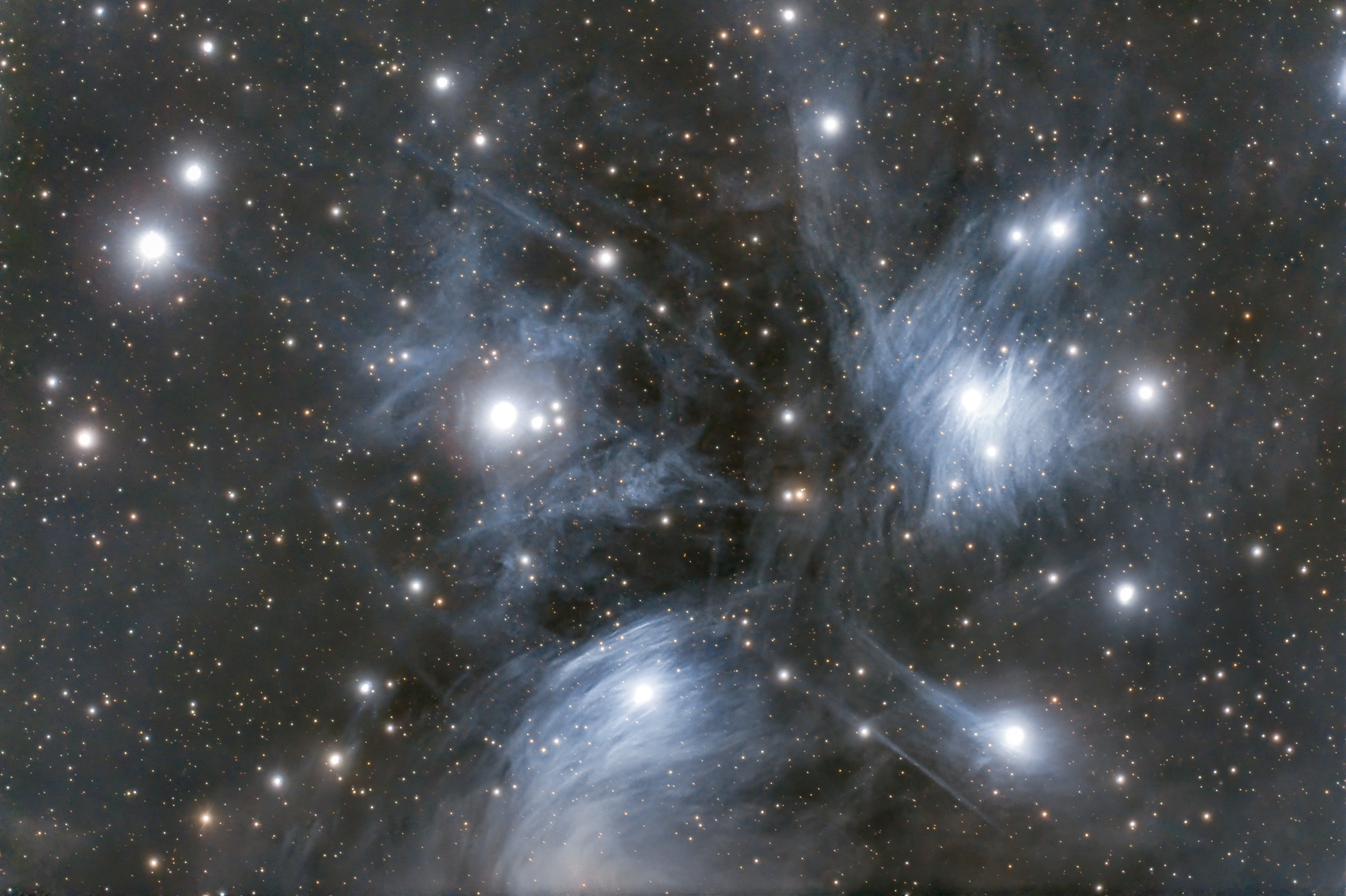 Deep space image of stars and nebulae, with bright stars and gaseous structures in the universe.