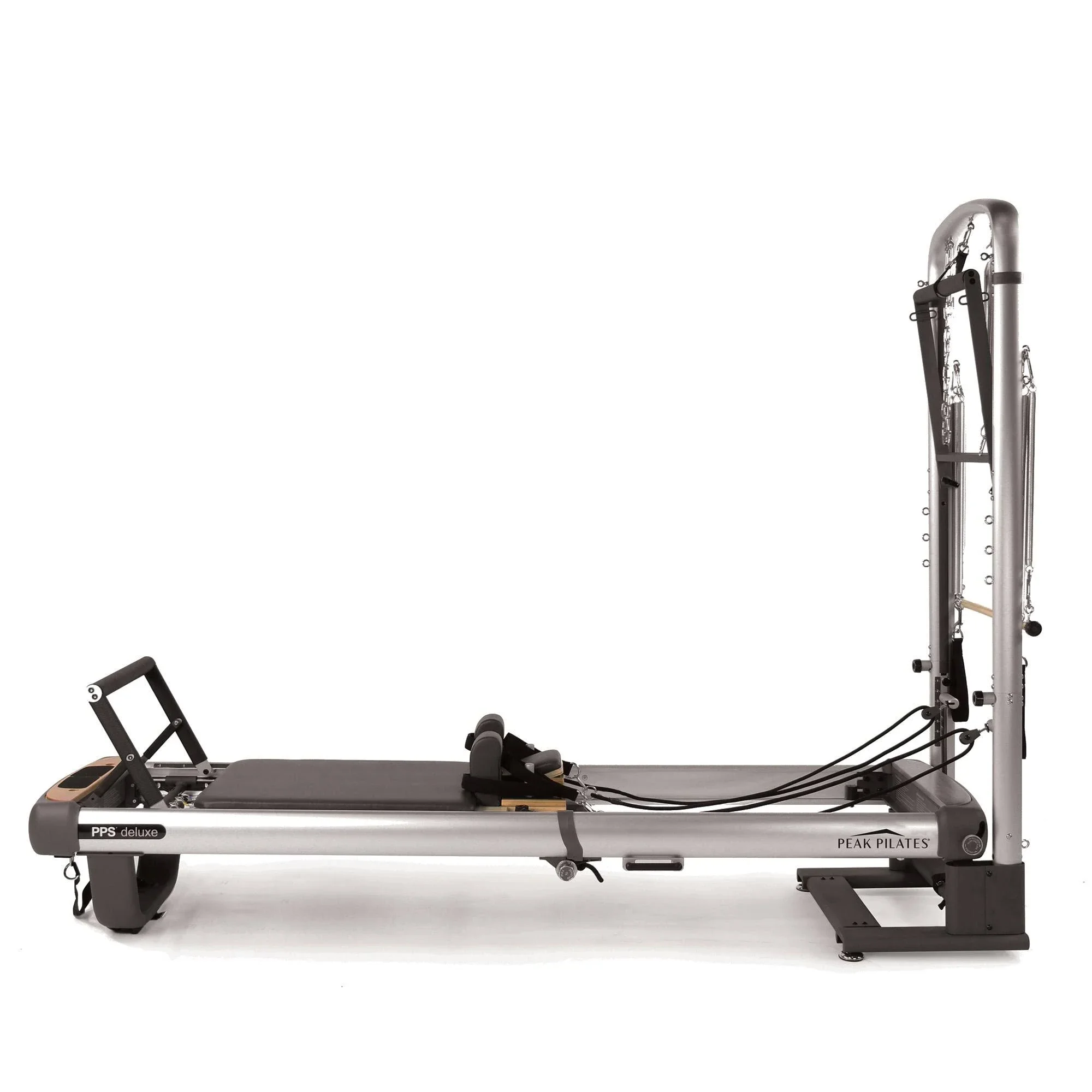 A Pilates reformer machine with adjustable straps and a padded platform used for exercise and fitness training.