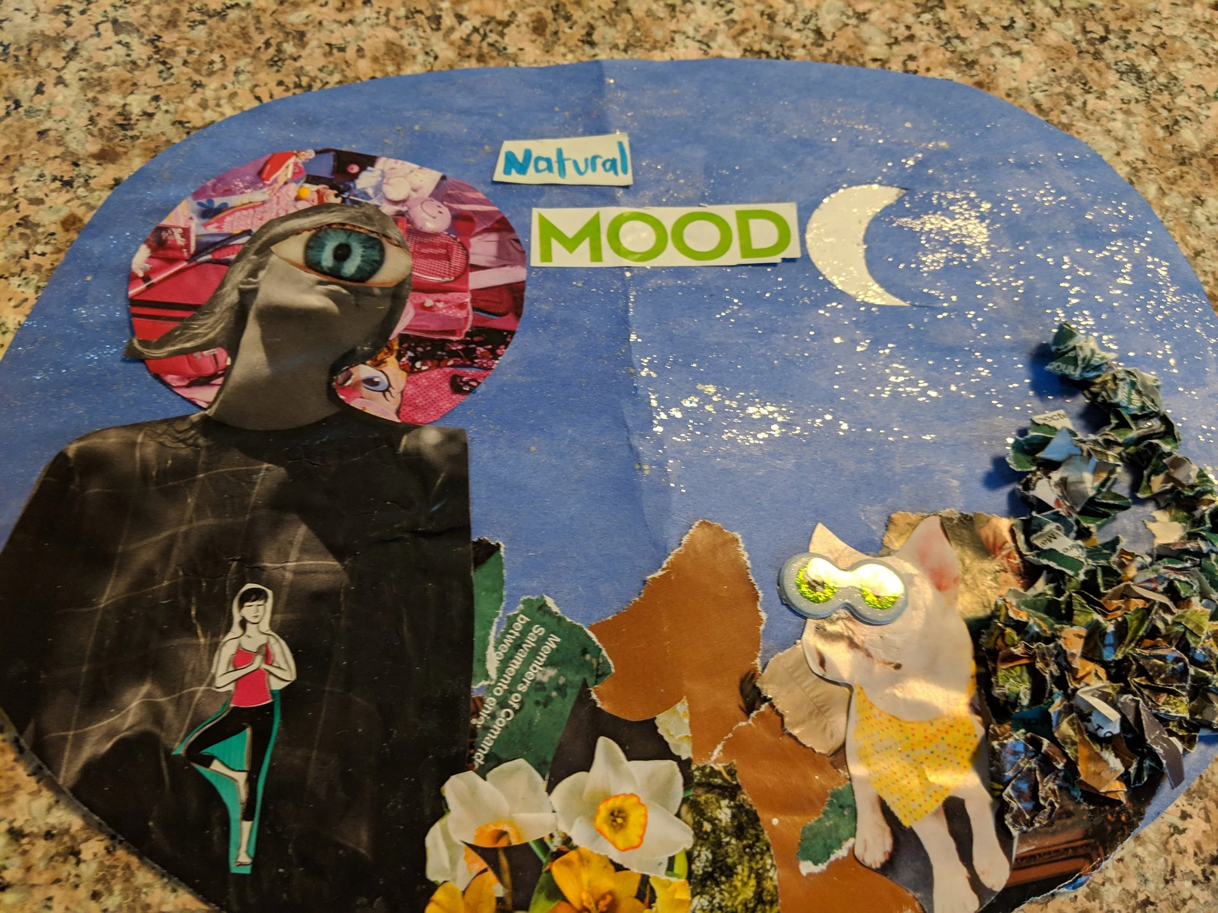 A colorful collage with cutout images, including an eye with a face, a woman practicing yoga, a moon, flowers, torn paper, and the words 'Natural MOOD' on a blue background with glitter.