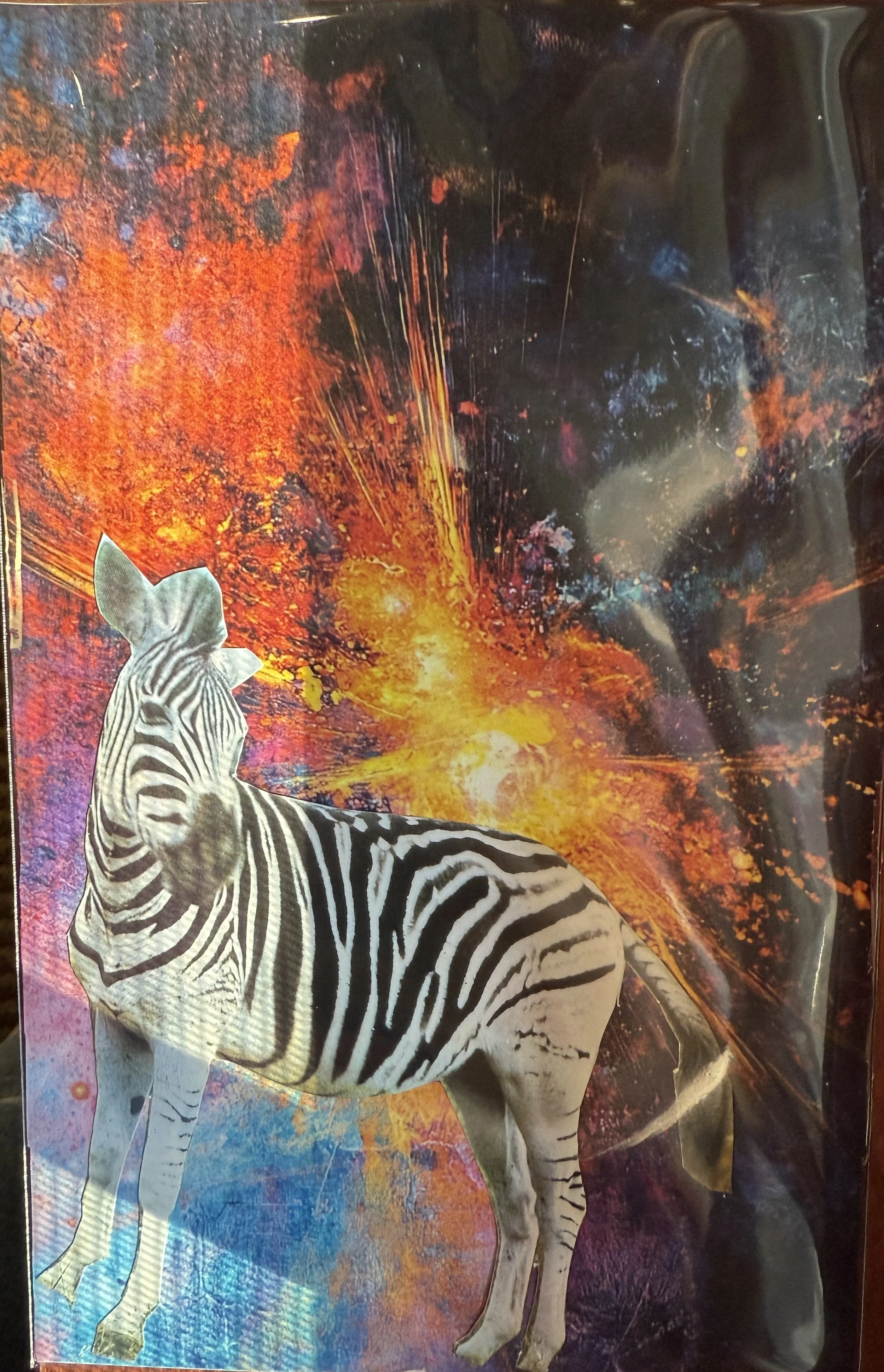 A zebra standing in front of a vibrant, abstract background resembling a cosmic or fiery explosion with bright orange, yellow, and dark colors.