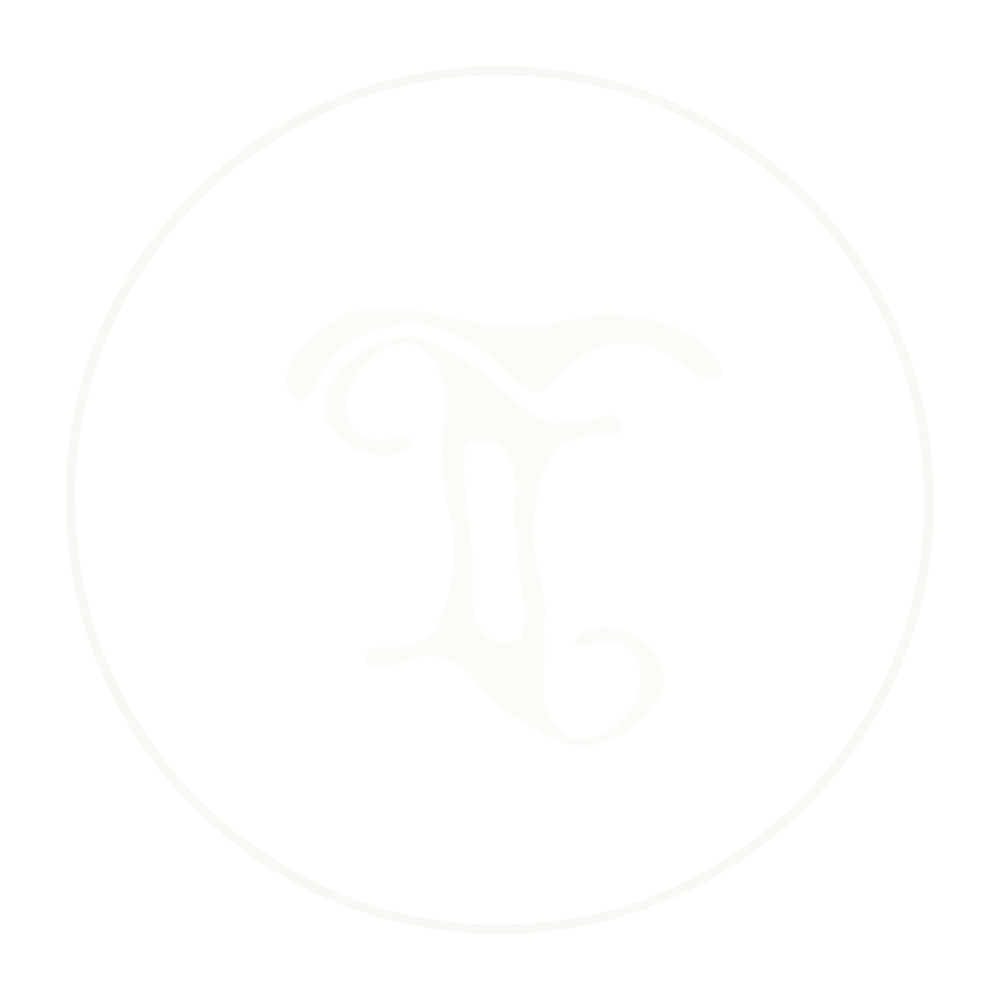 Stylized white letter 'L' inside a circle with a black background.