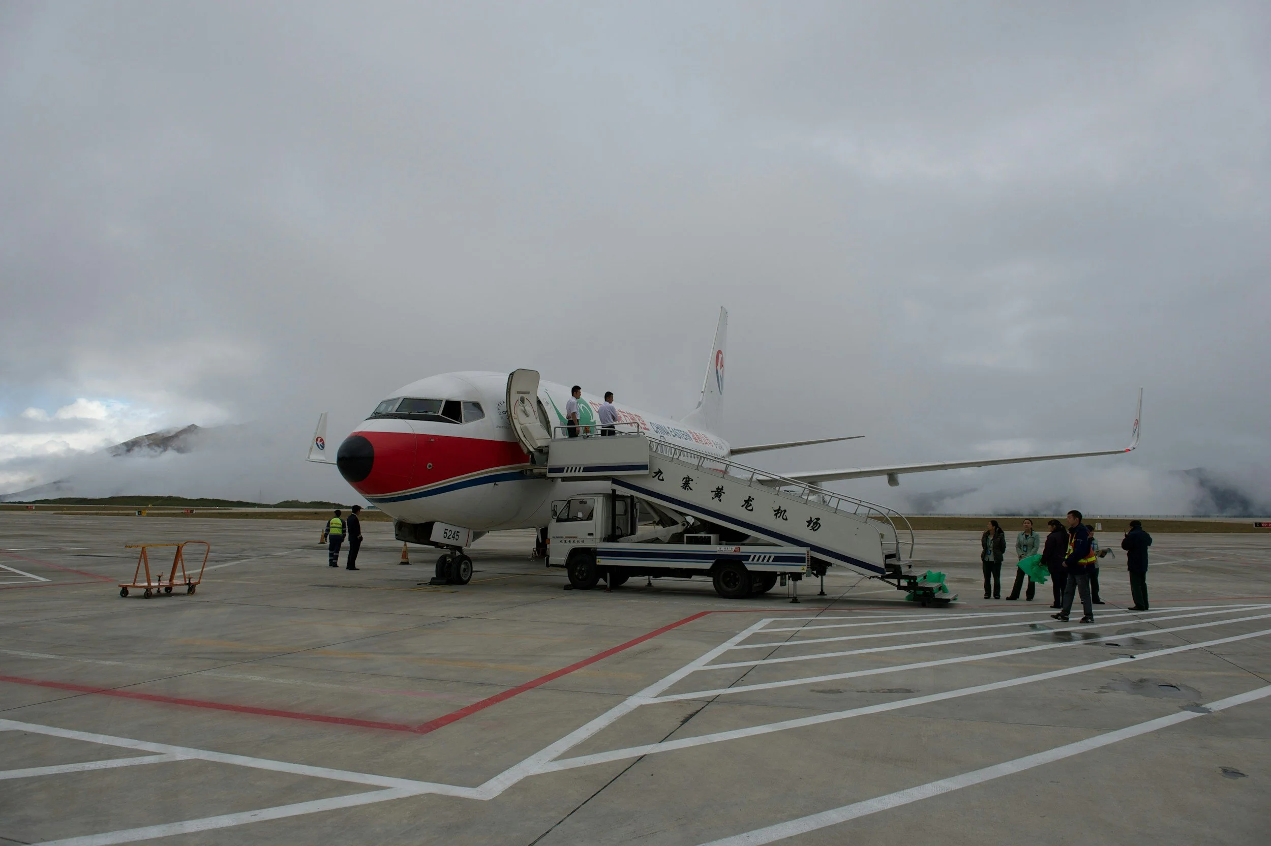 Plane boarding on tarmac