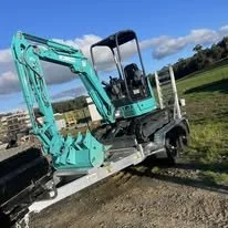 2.5t Kobelco mini excavator on trailer for hire in north Tasmania