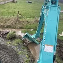 Kobelco SK25SR mini excavator digging on site