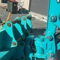 Kobelco SK25SR mini excavator with buckets