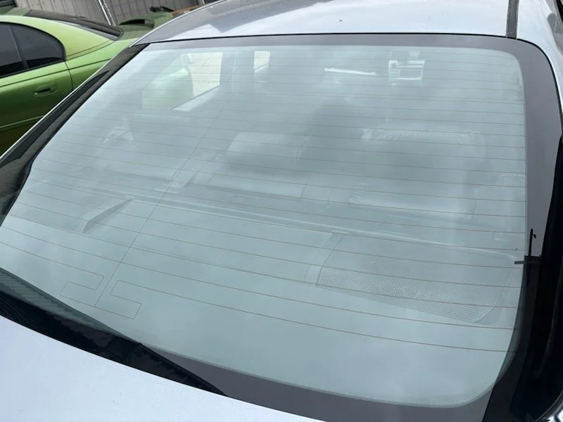 A car's rear windshield with no tint