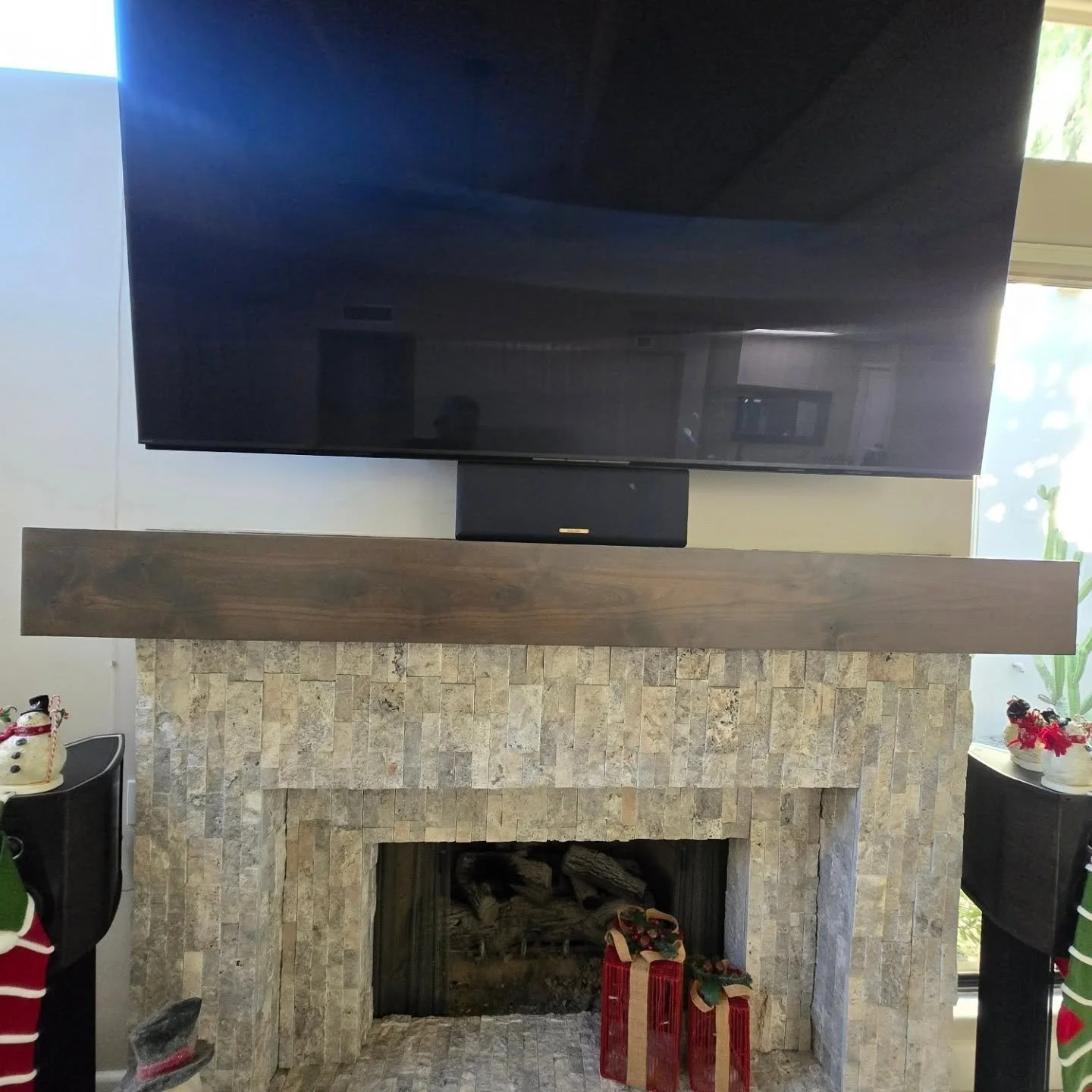 Gorgeous Knotty Adler mantel we made and installed!