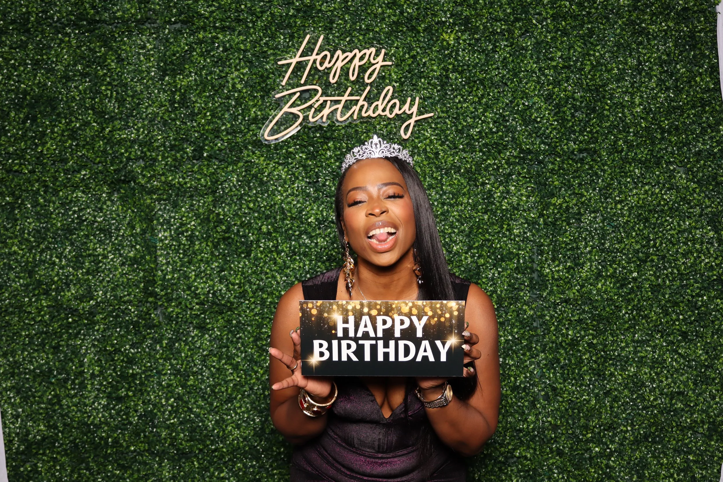 Luxury birthday photo booth experience with green hedge wall and “Happy Birthday” sign at Jacaranda Golf Club in Plantation, FL by AdCole Events