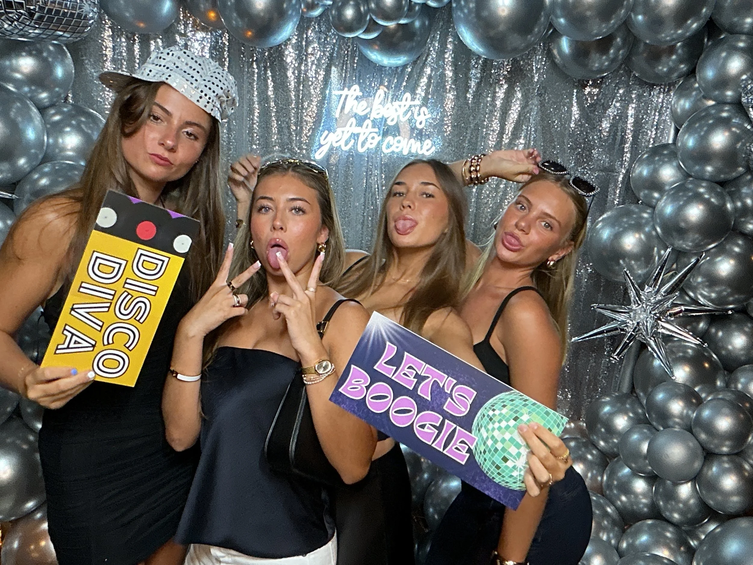 Graduation party photo booth rental at Sushi Jo's in West Palm Beach holding disco-themed props