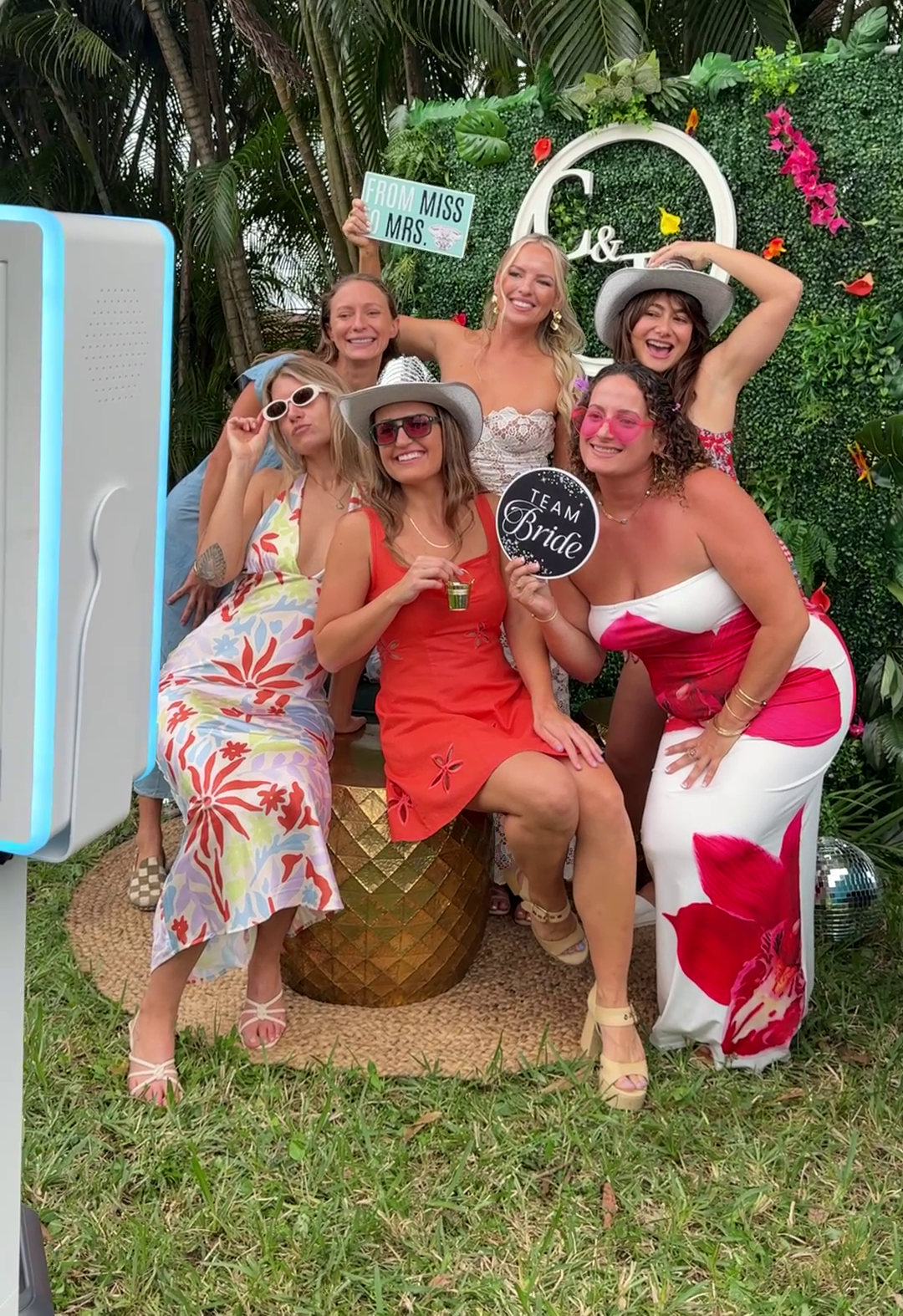 Luxury bridal shower photo booth with floral backdrop and elegant décor in South Florida