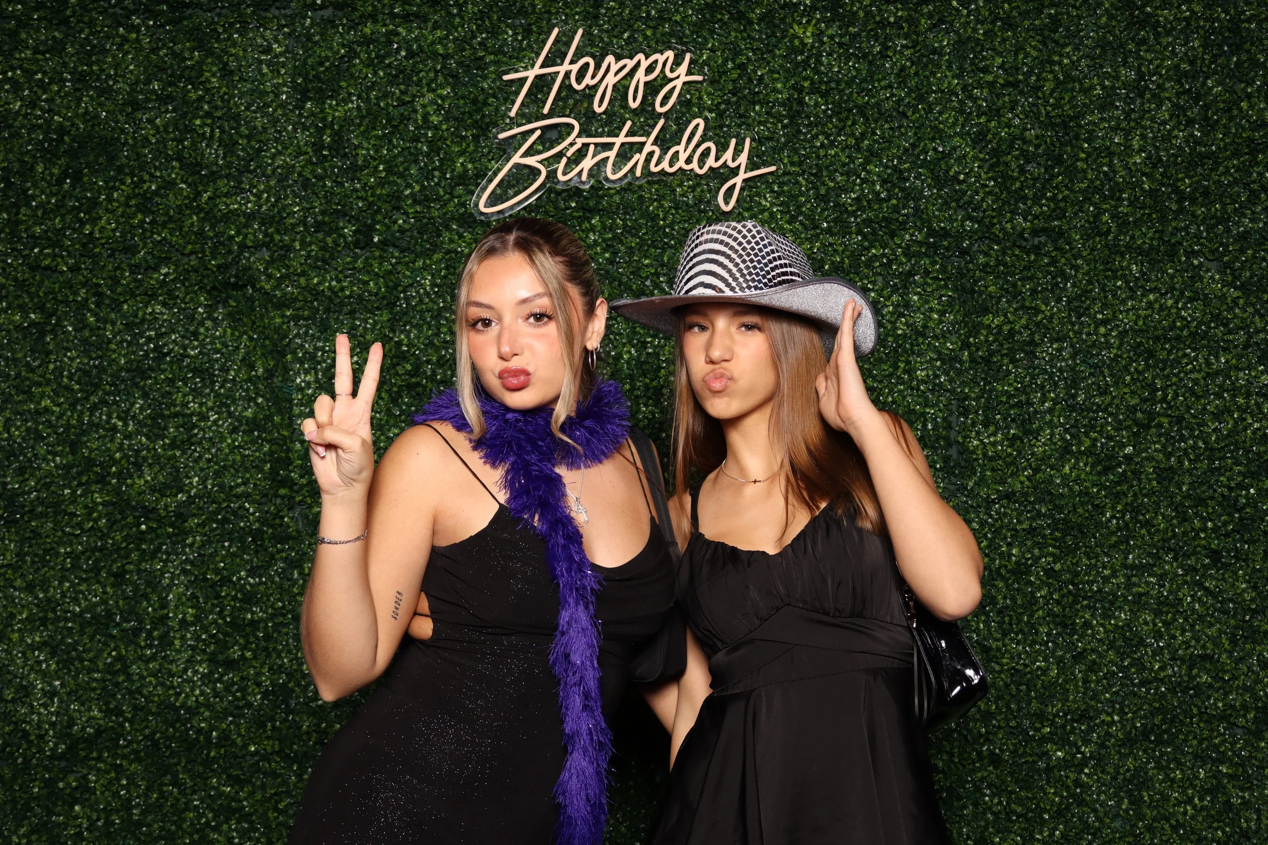 Luxury birthday photo booth experience with green hedge wall and “Happy Birthday” sign at Jacaranda Golf Club in Plantation, FL by AdCole Events