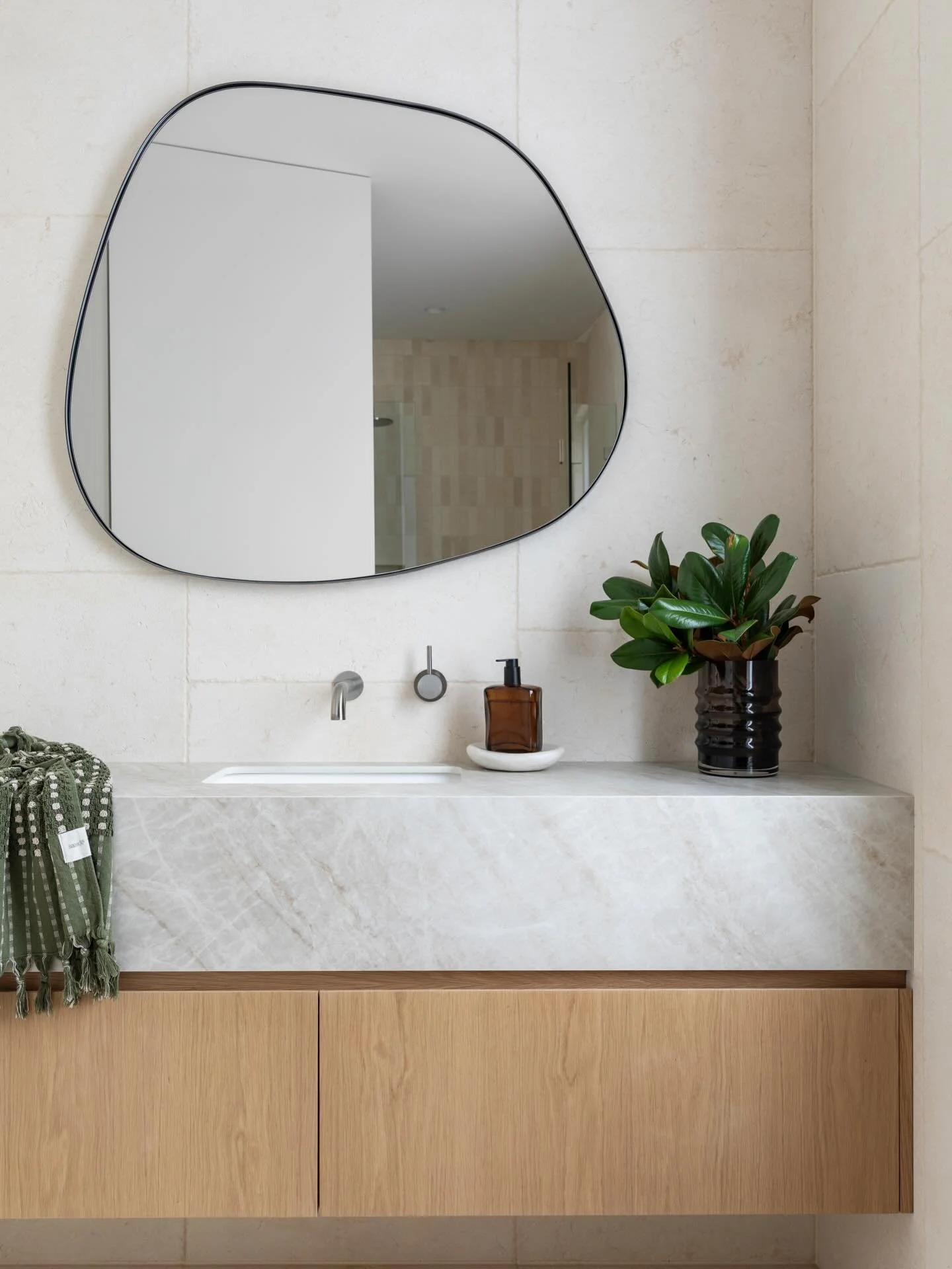 Powder room in our North Balgowlah home 🍃 

Interior Design &amp; Styling | @gonzalvezdesign 
Architecture | @deuchrassarchitects 
Builder | @randg_constructions 
Photography | @lulu_wells 

#gonzalvezdesignproject 
#naturallimestone 
#timberveneer
