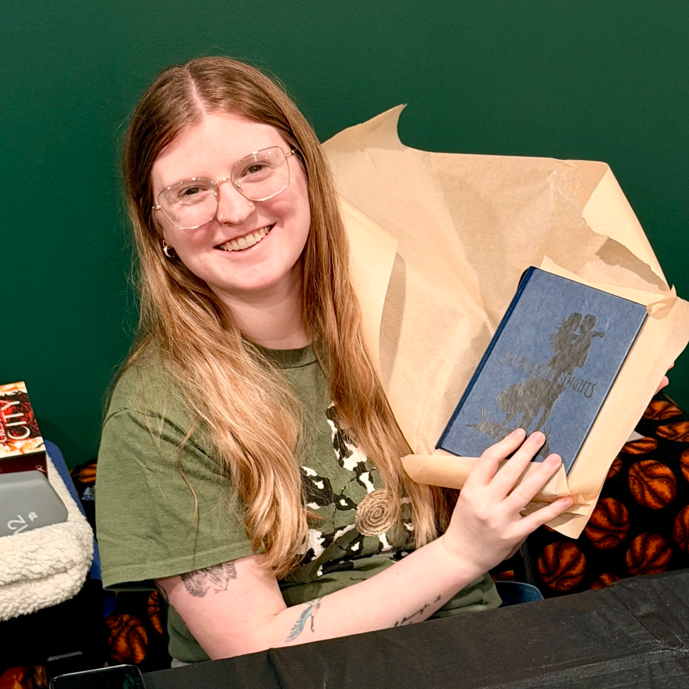 A happy customer holding up her Wuthering Heights rebind