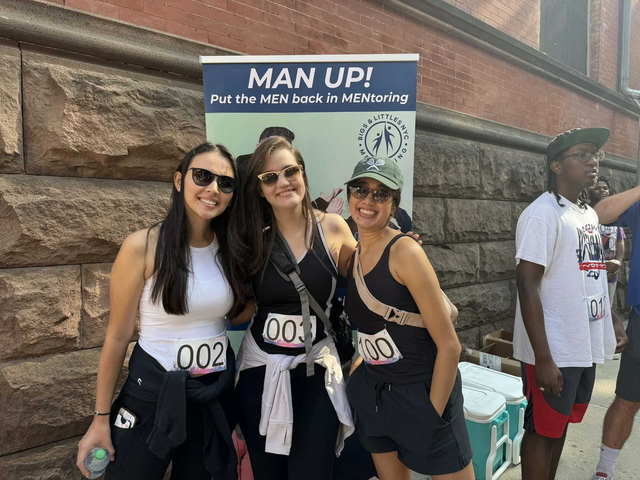 Participants celebrating at the Bigs & Littles NYC 5K event