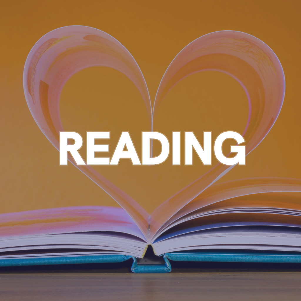 Open book with pages shaped into a heart, with the word 'READING' overlaid in white text, against a yellow background.