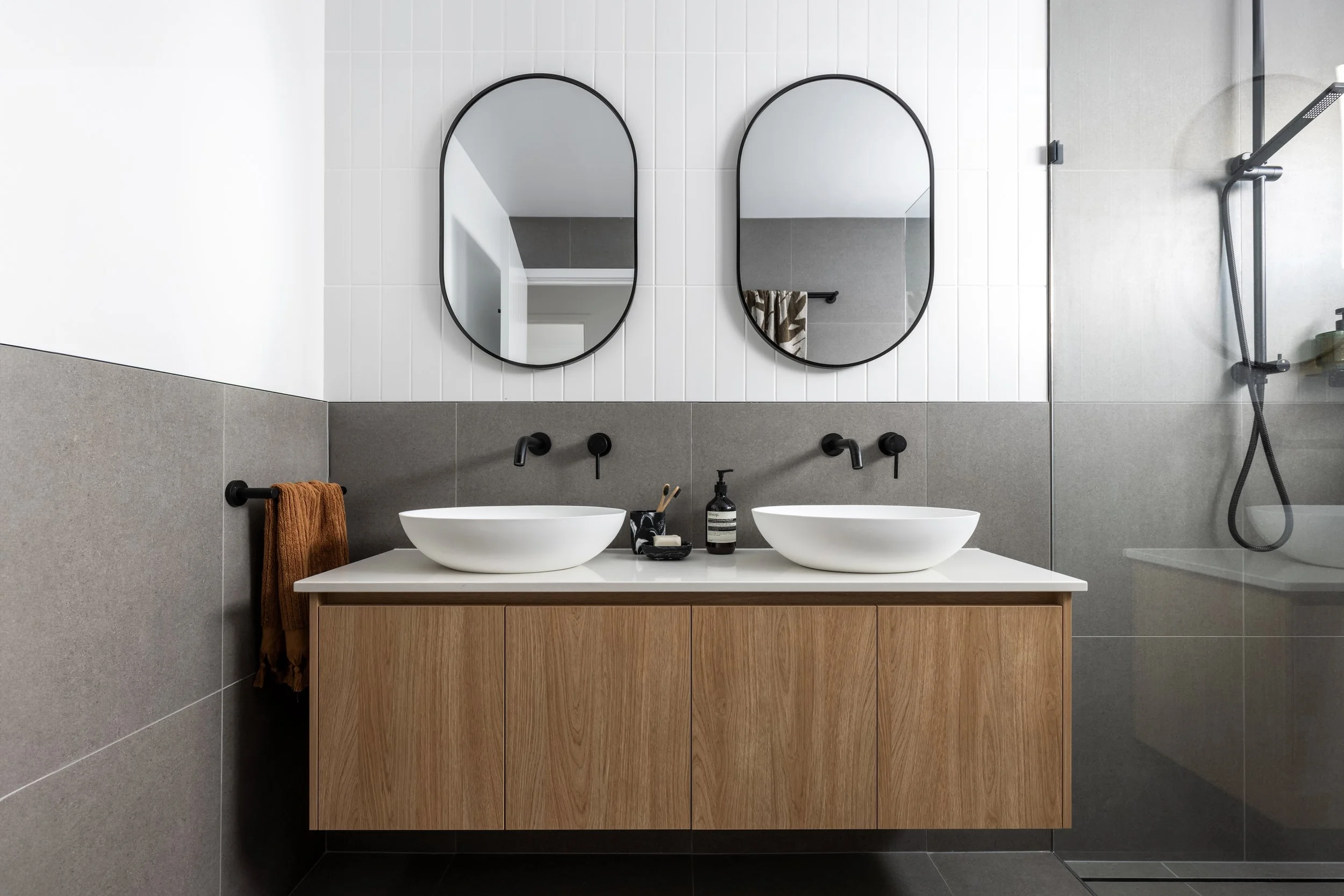 Contemporary bathroom renovation with double vanity and walk-in shower