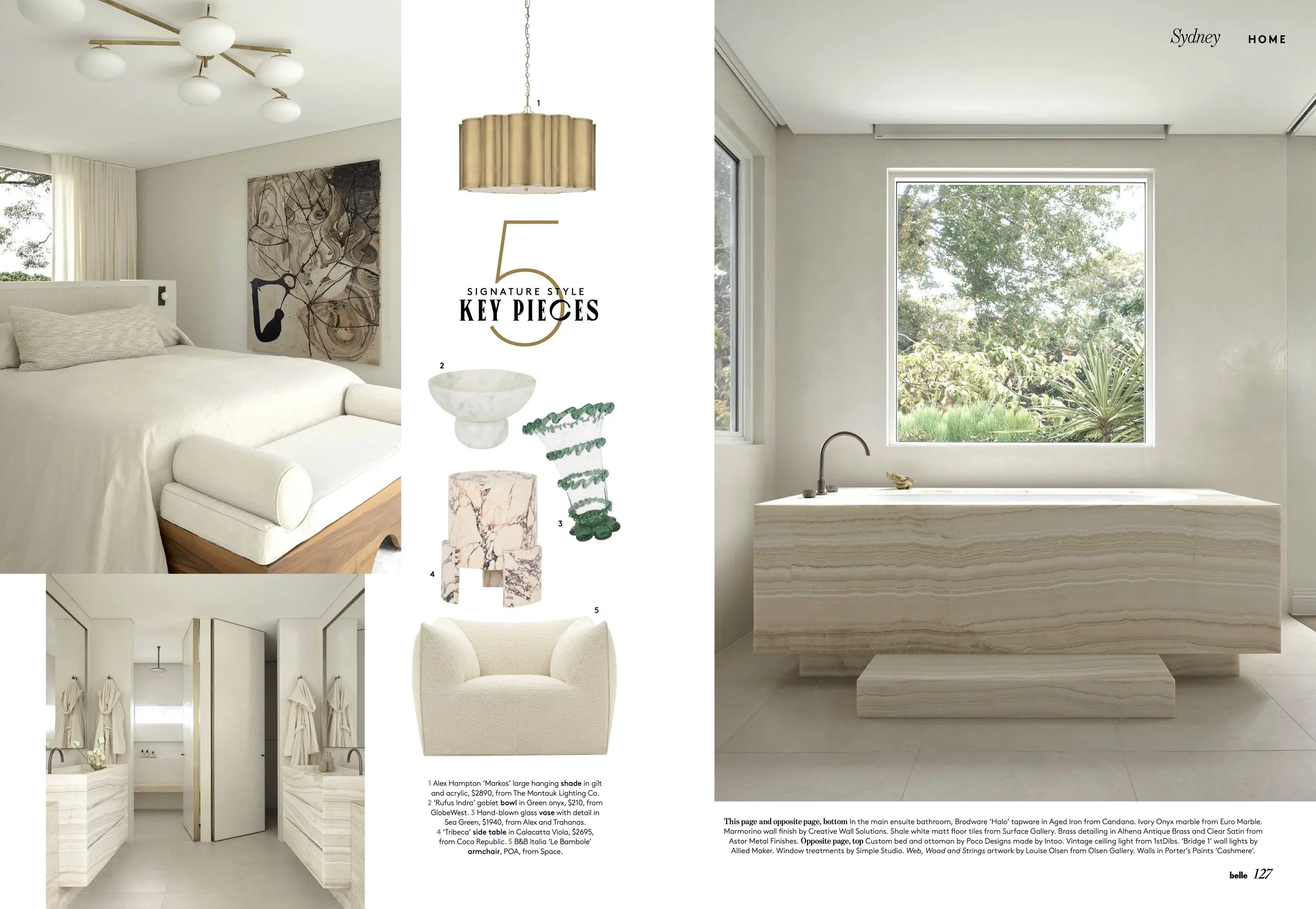 A bedroom with a white bed, headboard, and artwork on the wall, a modern chandelier, and a window with curtains. The adjacent page features design key pieces: a gold pendant light, marble bowl, green glass hair clip, marble side table, and a cream upholstered armchair. The main bathroom has a large window, a marble bathtub, and neutral walls and floors.