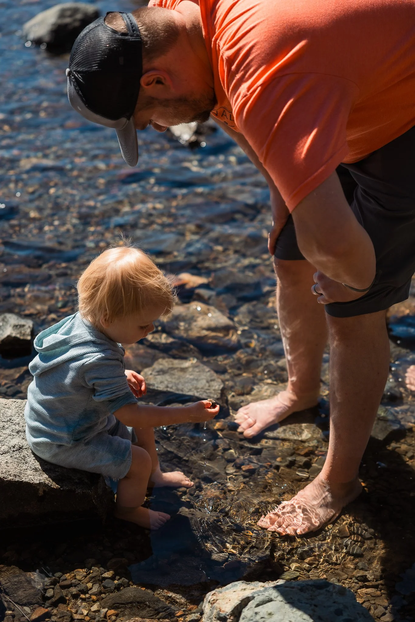 Dad and Toddler Playing Rocks at Fallen Leaf Lake