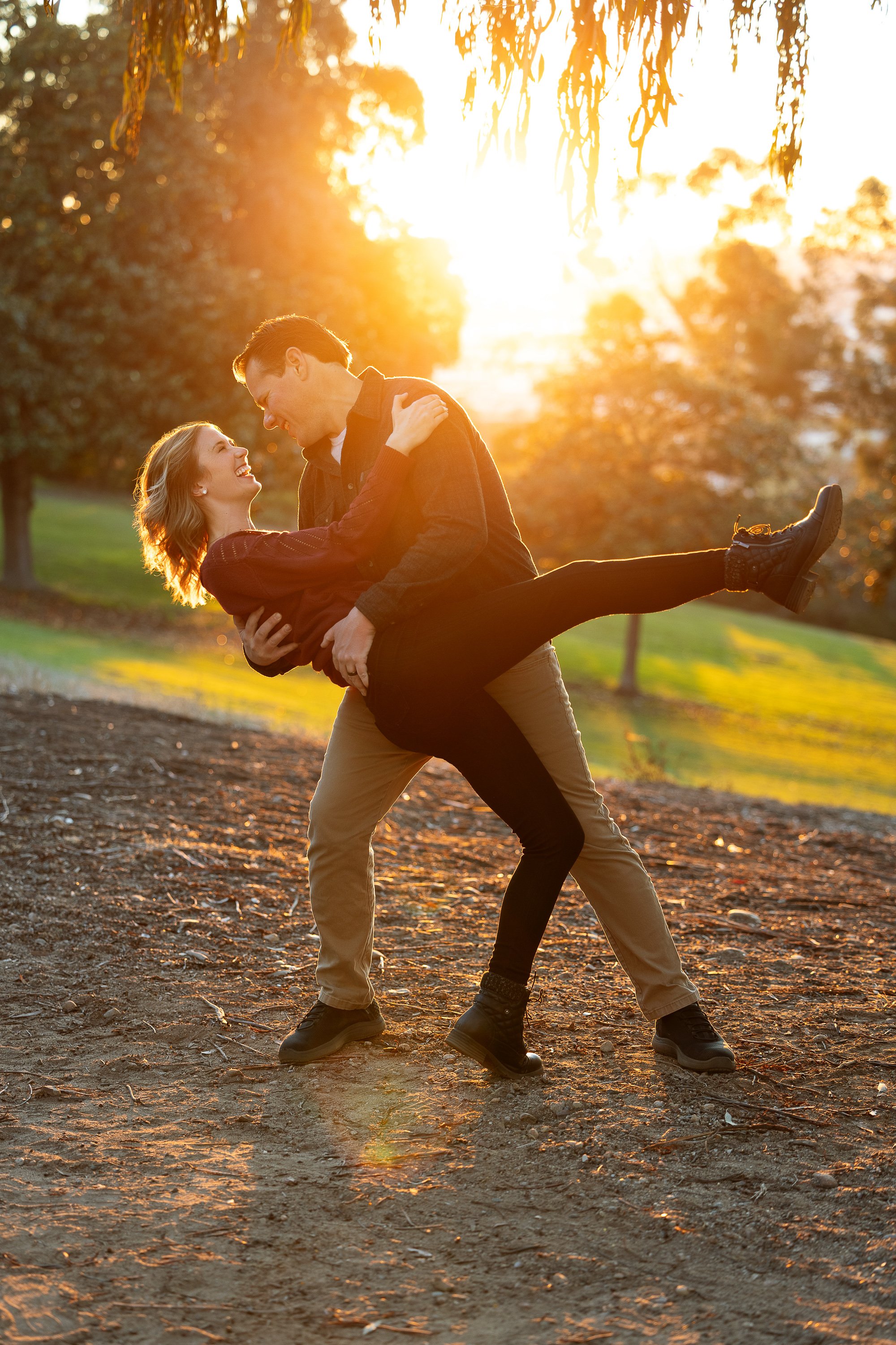 Alexis and Cameron rediscover their first dance at sunset, completely lost in the moment after Diana's gentle prompt during their session in Del Mar. Documentary portrait by Ruwan & Diana Photography.