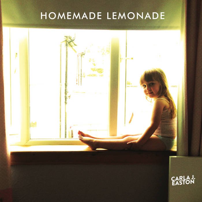 Carla J Easton Album artwork. A young girl sitting on a window ledge with sunlight streaming through the window. The text 'Homemade Lemonade' is at the top and 'Carla J. Easton' is at the bottom right corner.