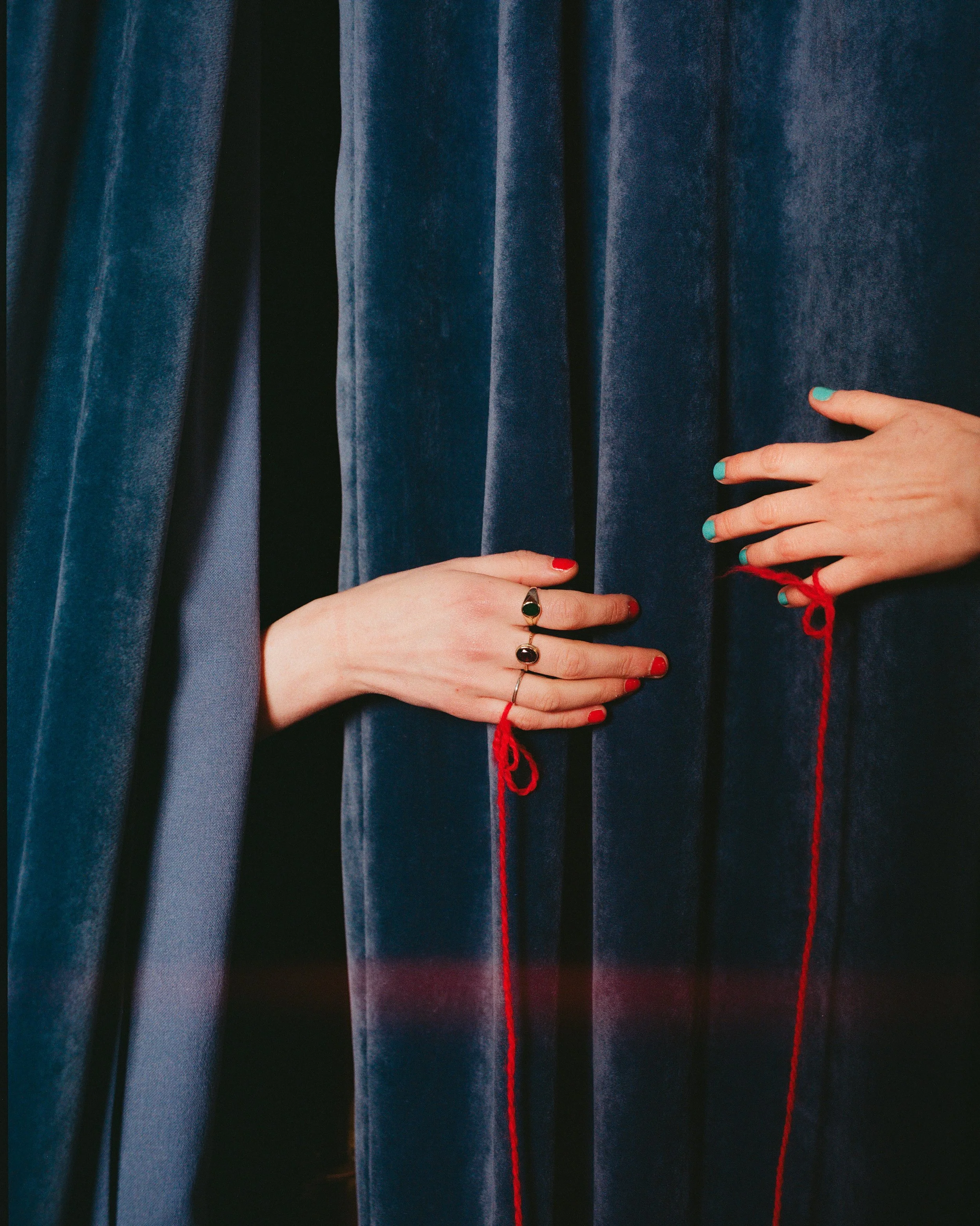 Carla J Easton Album artwork - I Think That I Might Love You Two hands with manicured nails and rings holding or pulling dark blue velvet curtains with red strings.