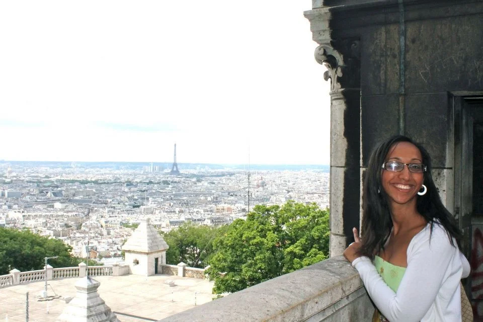 Majda in Paris with the Eiffel Tower - one of 50+ countries explored and available through Namajo travel planning