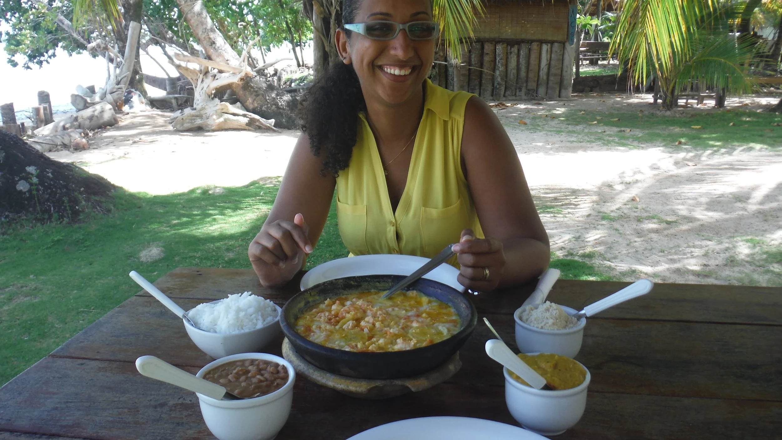 Majda enjoying local cuisine during her travels - authentic cultural experiences through Namajo trip planning