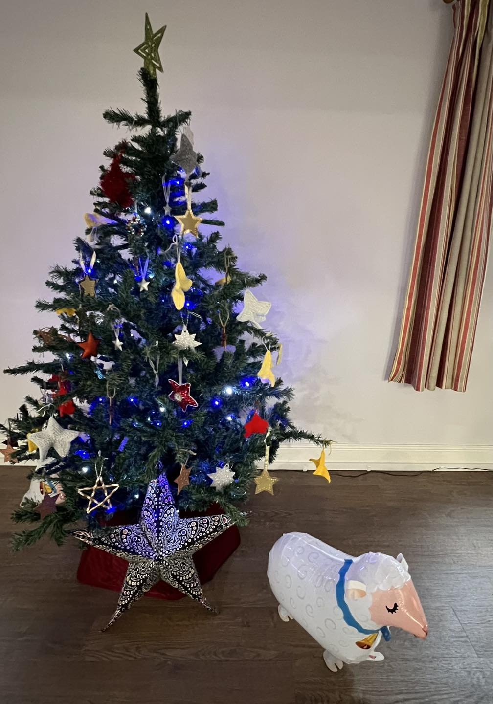 Christmas; our tree decorated with stars made by people on our estate and our church family.