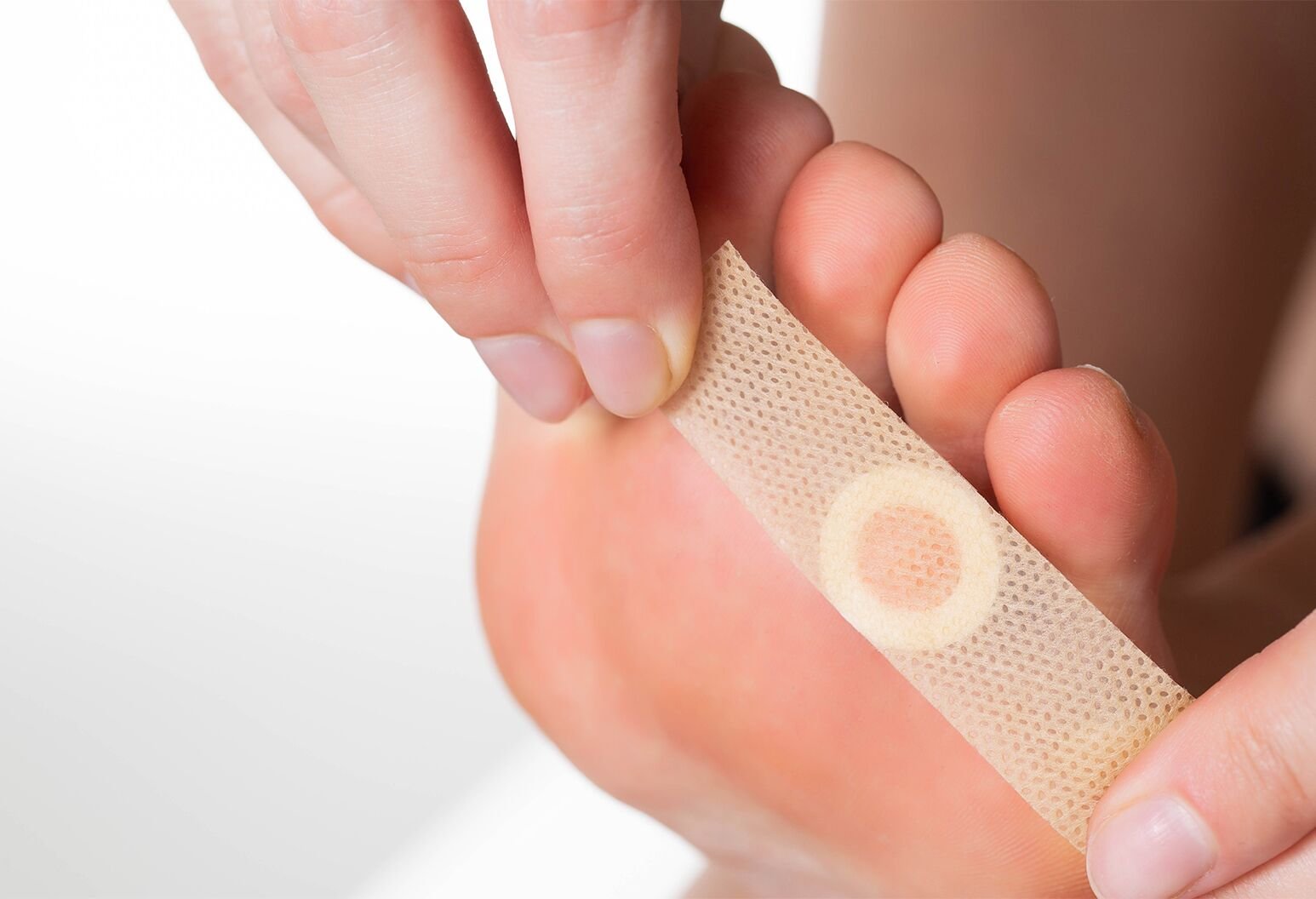 Foot with bandaid for wart removal