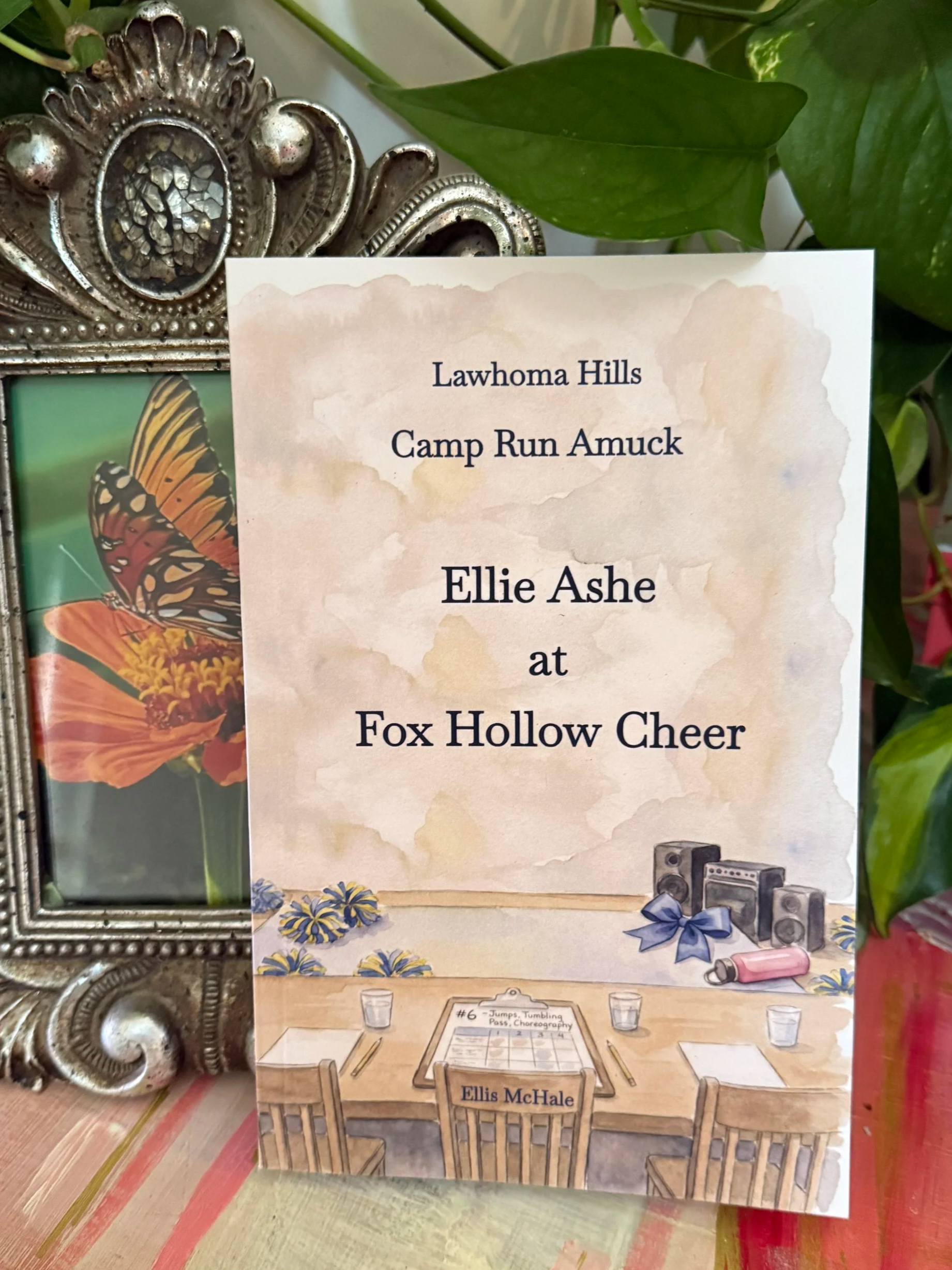 Ellie Ashe at Fox Hollow Cheer middle grade book on a table with greenery