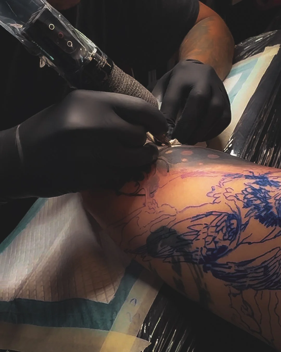 Tattoo artist working on custom tattoo at InkArt Tattoo Studio Miami
