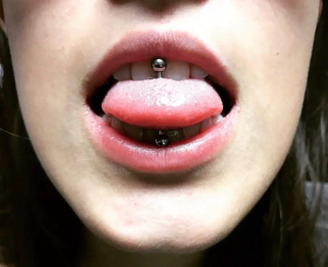 Professional tongue piercing performed at InkArt Tattoos piercing studio Miami.jpg