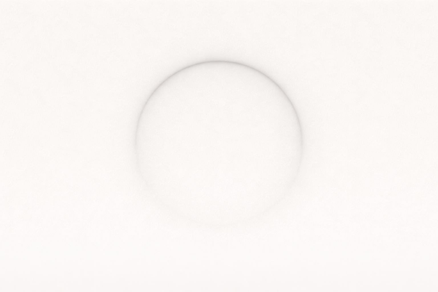 Subtle circular form on a light, off-white background.