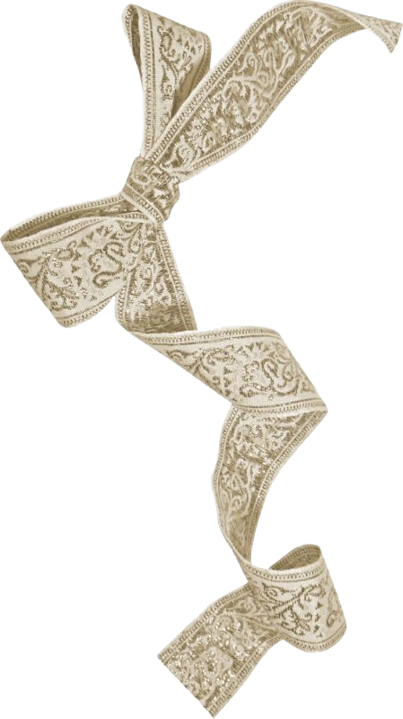 A beige ribbon with ornate embroidery tied in a bow.