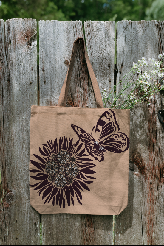 Canvas tote bag featuring an original butterfly and wildflower surface pattern designed by Driftzen Studio.