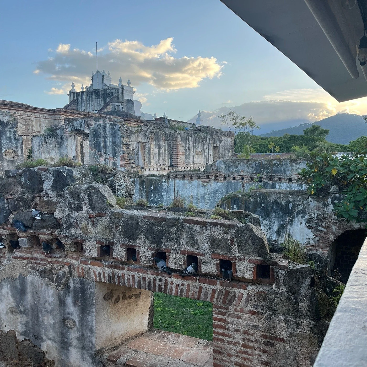 Do you know where this is? There are ruins everywhere in Antigua - some easily accessible from the street, and others locked behind gates. Others, like these, get a unique perspective from a different angle.

What you're looking at are the ruins on t