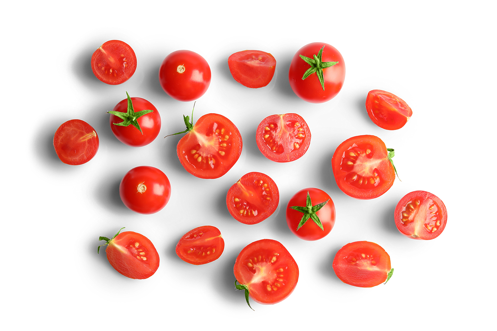 Various cherry tomatoes, both whole and sliced, are scattered on a black background.
