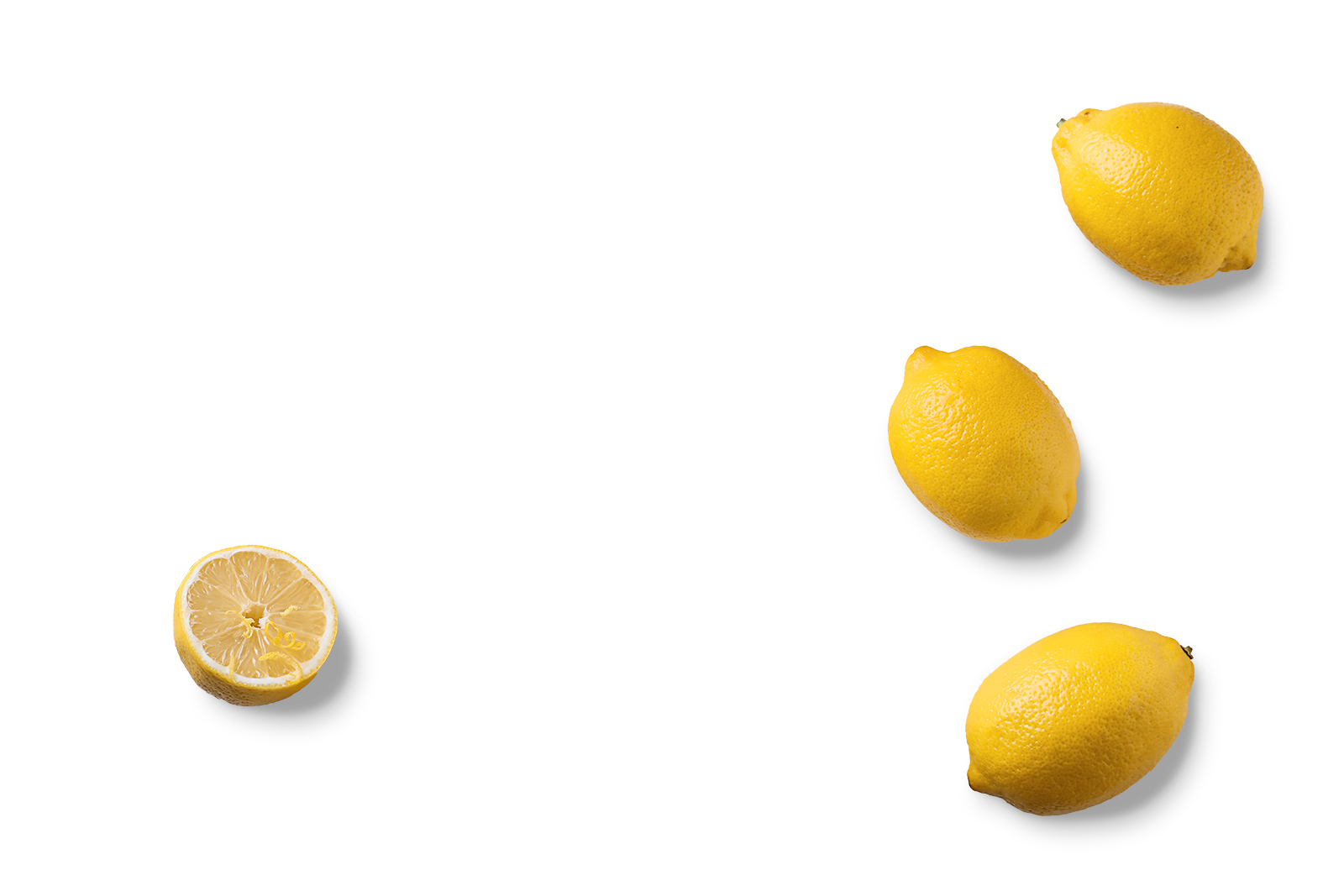 A lemon cut in half showing the inside, with whole lemons above and below it on a black background.