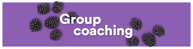 Blackberries scattered around purple background with white text that says "Group coaching".