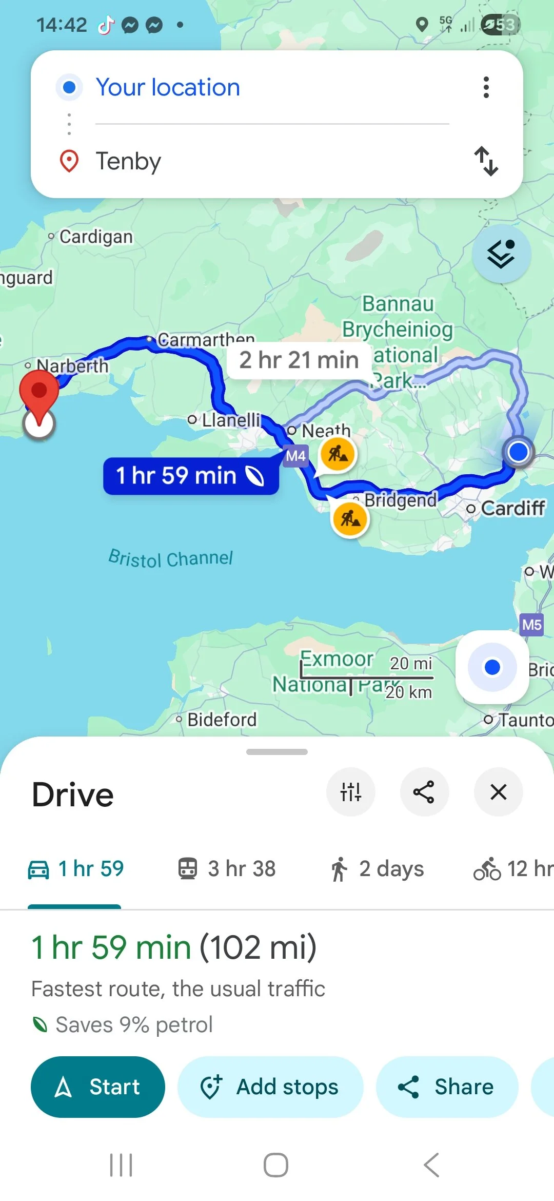 A map showing a driving route from Cardiff to Narberth in Wales, with options for fastest, scenic, walking, and biking routes. The route passes through the Bristol Channel, with icons indicating roadwork along the way.