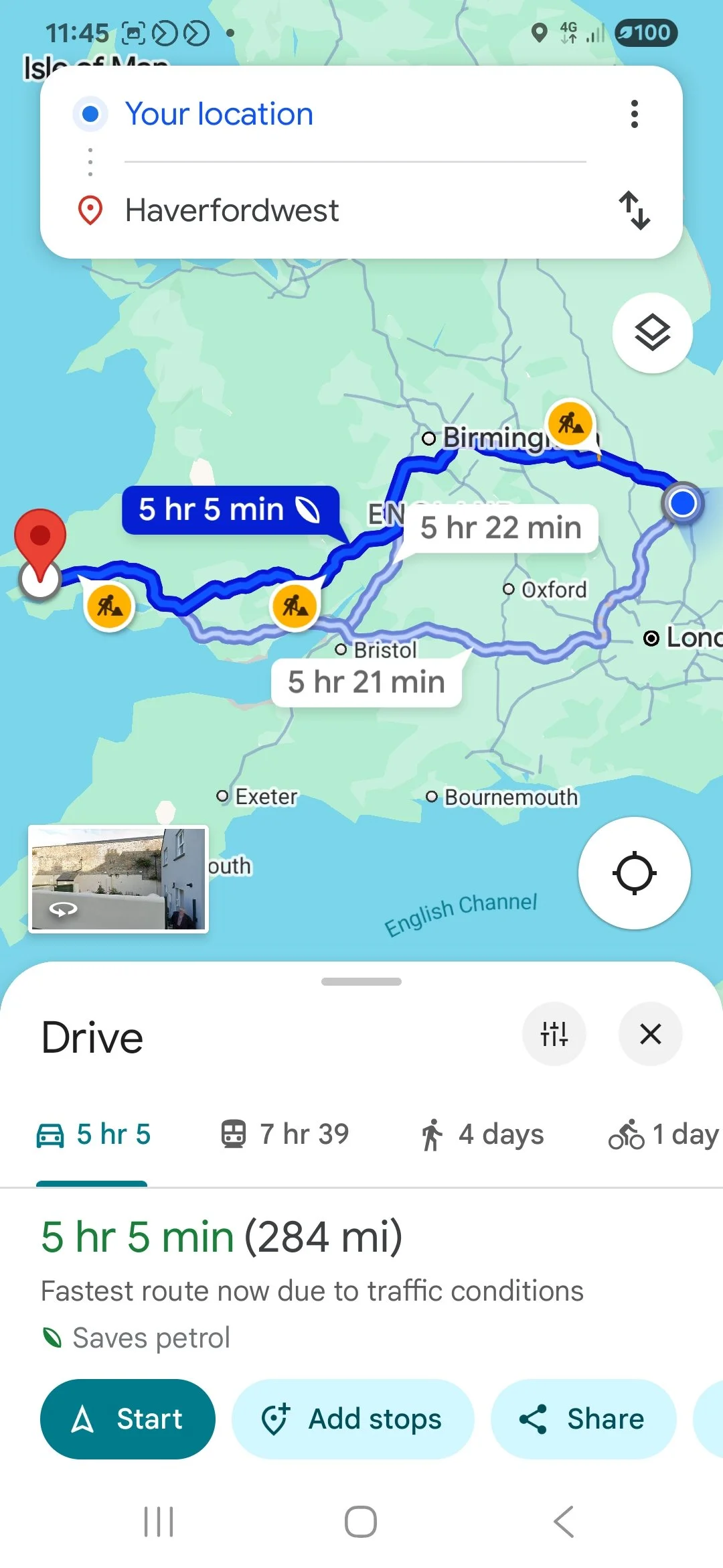 Map showing a driving route from Haverfordwest to a location on the coast in England, with estimated travel time of 5 hours and 5 minutes, including icons for construction and rest stops along the way.