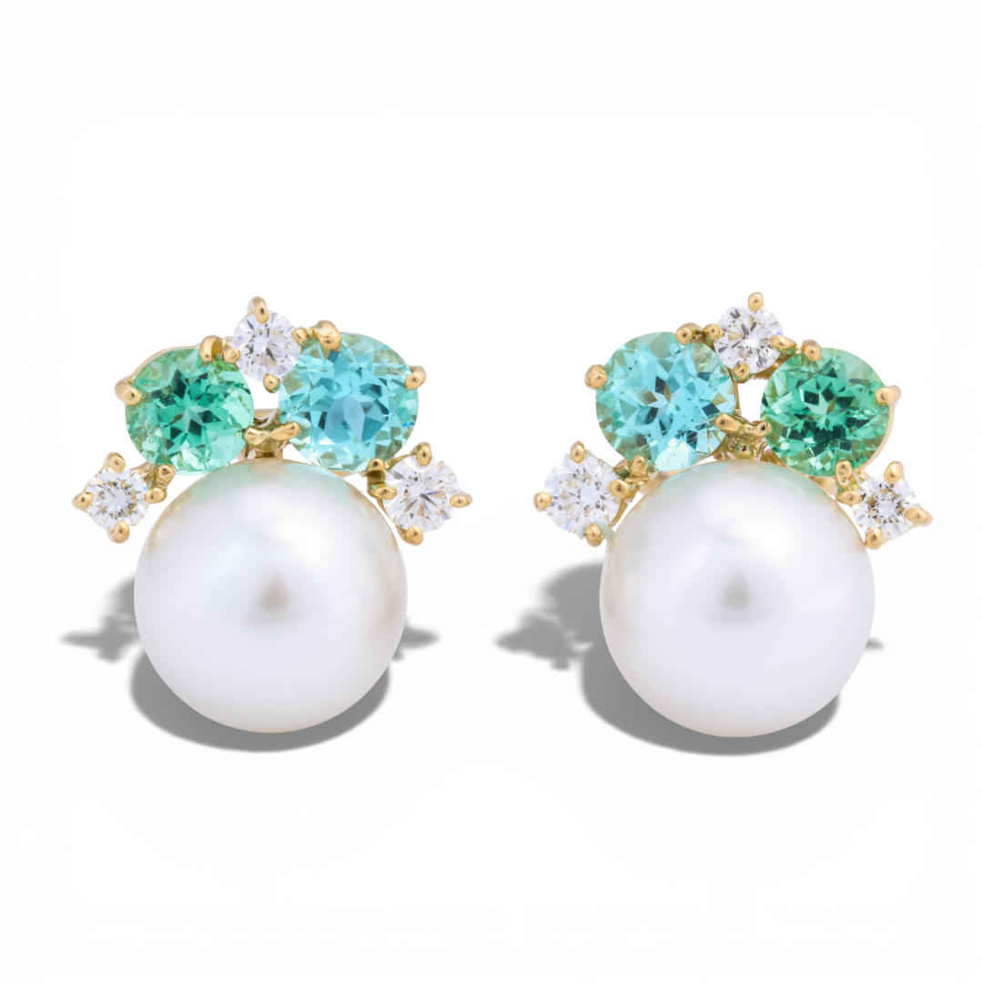 Donna Vock pearl cluster gemstone earrings with green and blue stones, small clear diamonds, set in gold, on a white background with shadows.