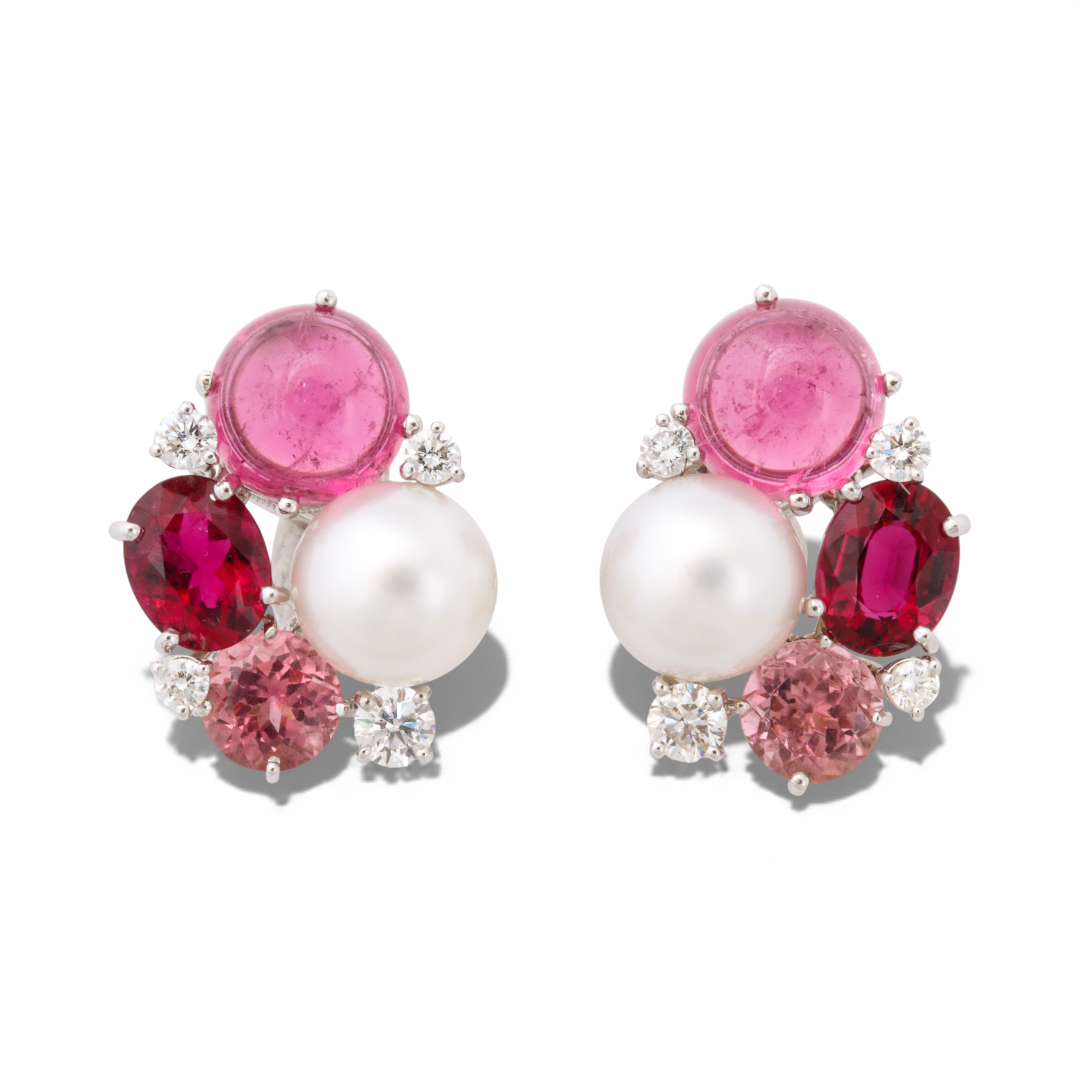 Donna Vock pearl cluster earrings featuring pink gemstones, white pearls, red gemstones, and clear diamonds on a white background.