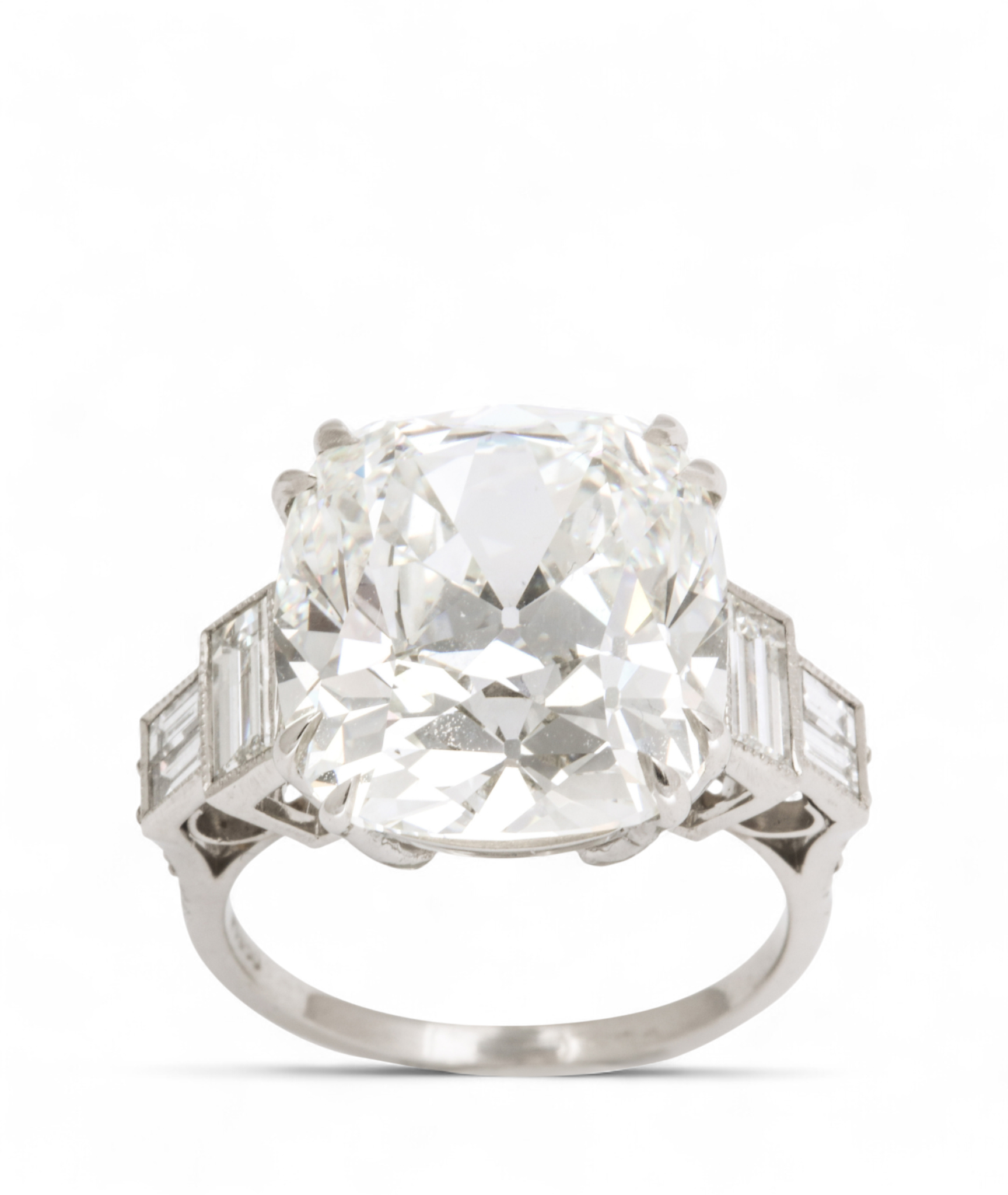 Custom Donna Vock engagement ring. A silver ring with a large, cushion-cut diamond center stone and diamond side accents, isolated on a white background.