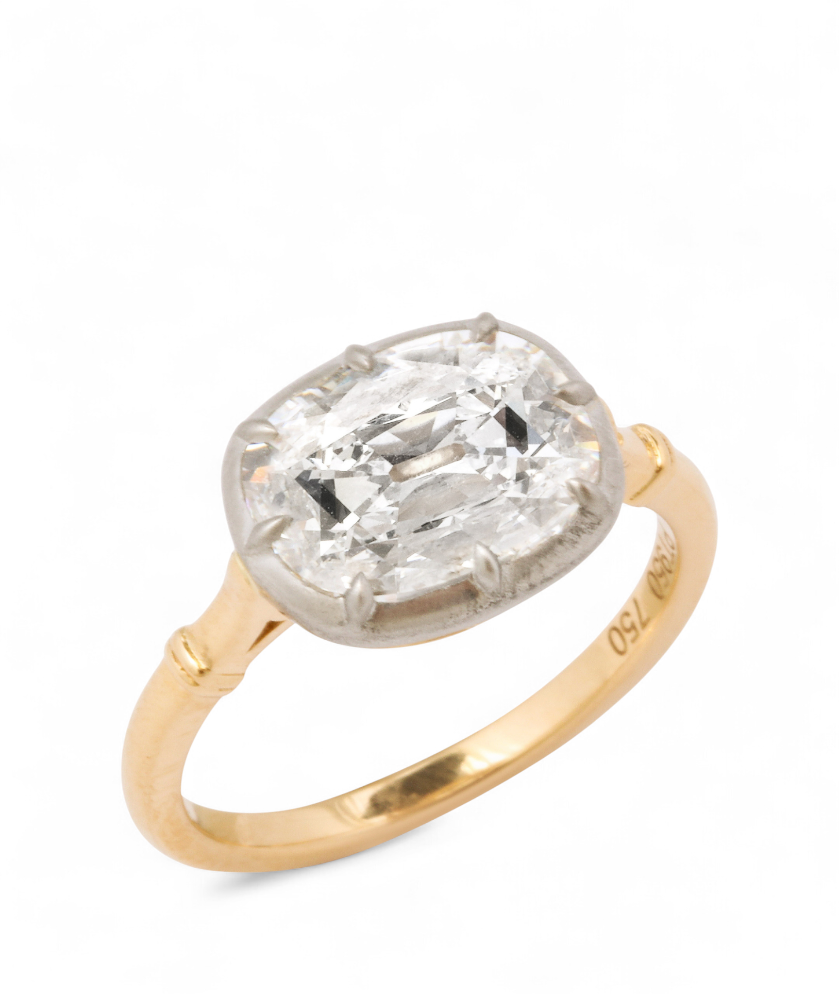 Custom Donna Vock engagement ring. Gold ring with a large oval diamond solitaire setting