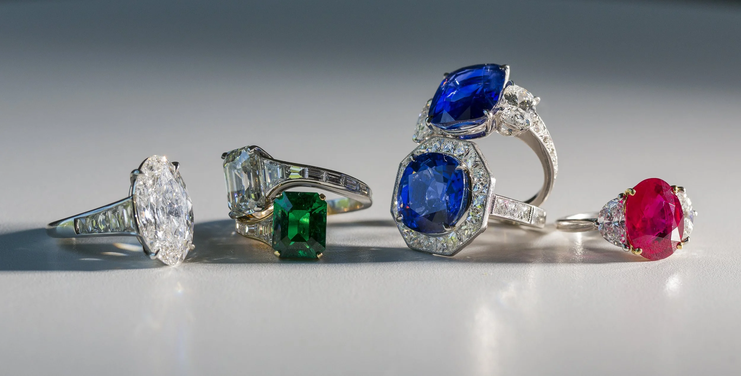 Colombian emerald, blue sapphire, diamond, and ruby rings.