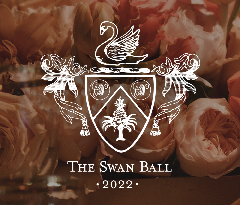 A floral background with an overlay of a crest featuring a swan, shield, and decorative elements, with the text "The Swan Ball 2022" at the bottom.