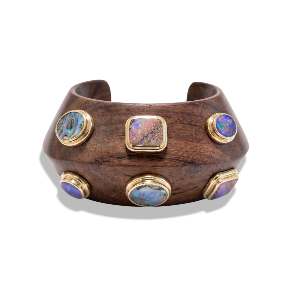 Custom Donna Vock bangle bracelet. A wide natural wooden bracelet with five opal inlays set in gold frames.