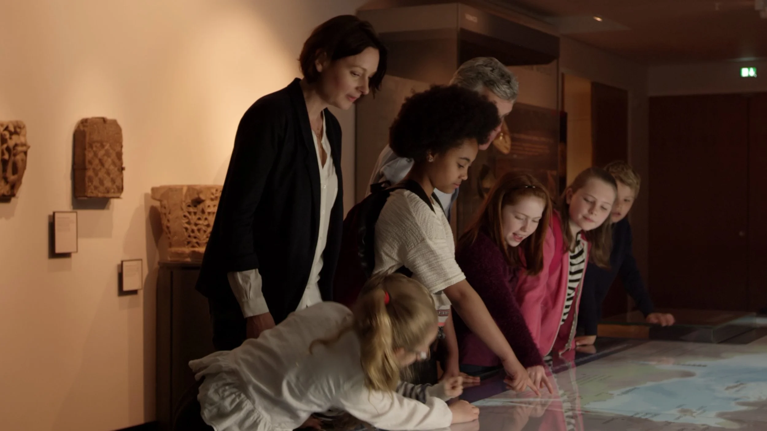 pupils-on-school-trip-to-museum-looking-at-map-shot-on-r3d-SBI-350047769.jpeg