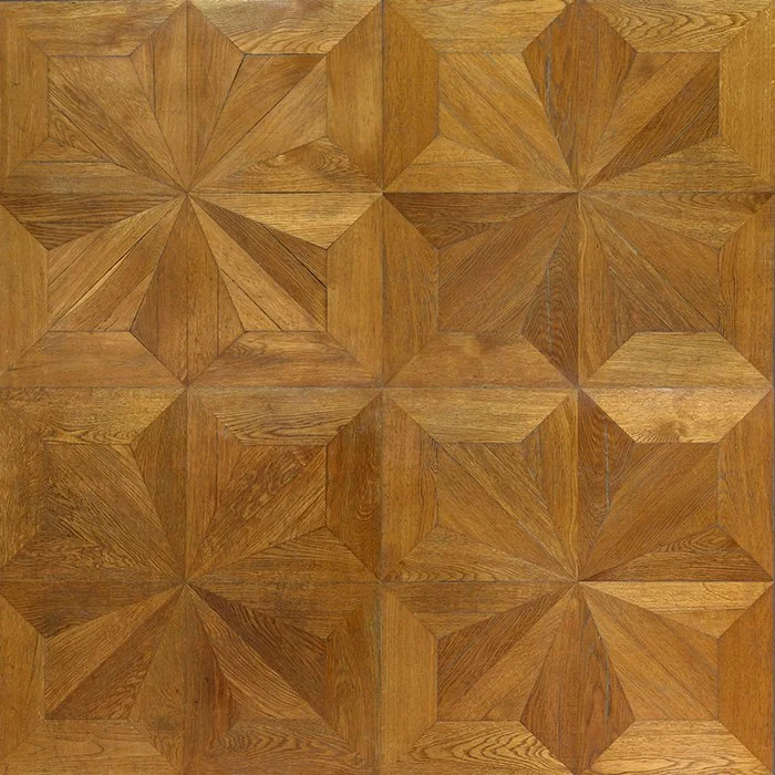 Patrón de piso de madera con diseño geométrico de cuadros y estrellas.